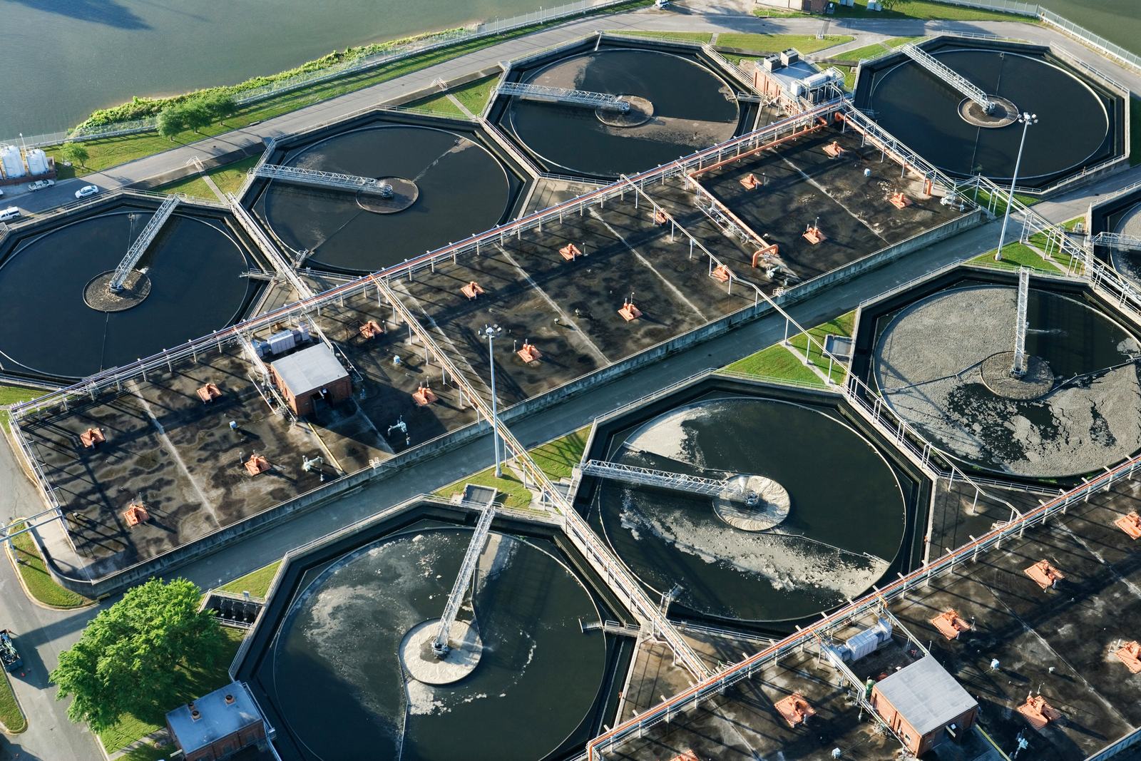 Aerial view of a wastewater treatment plant – circular clarifiers and sludge-digestion tanks